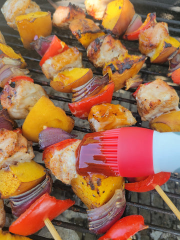 skewers being sauced