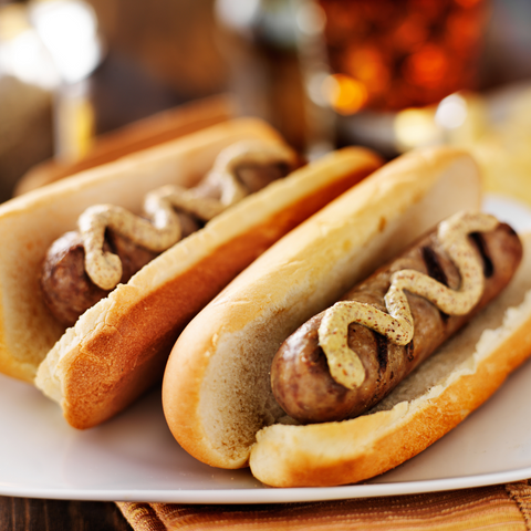 Bratwurst on bun with mustard